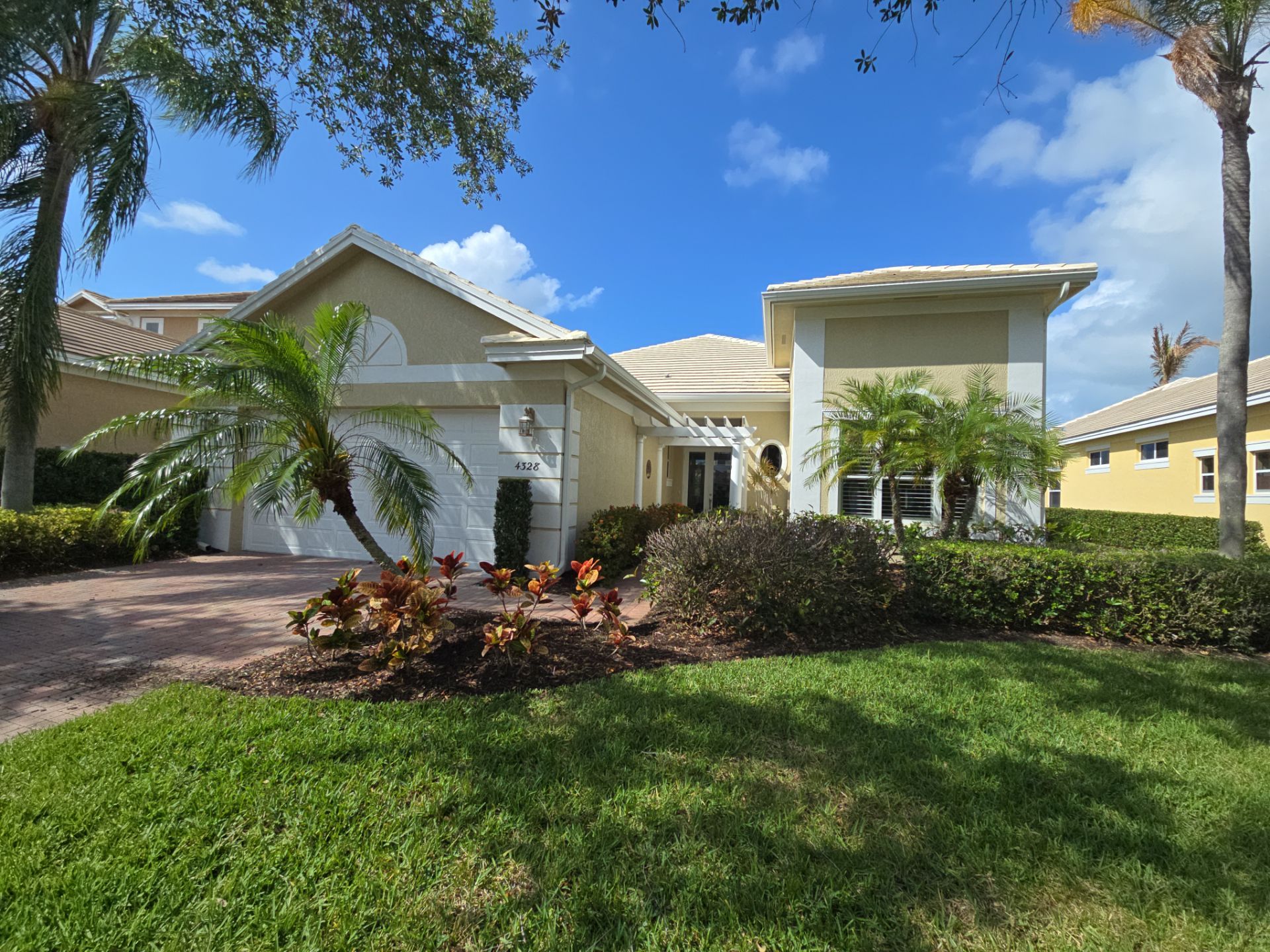 Single-story residential home with tile roofing and landscaped front yard showcasing residential roofing in Florida by My Florida Roofing Contractor in Vero Beach, Florida
