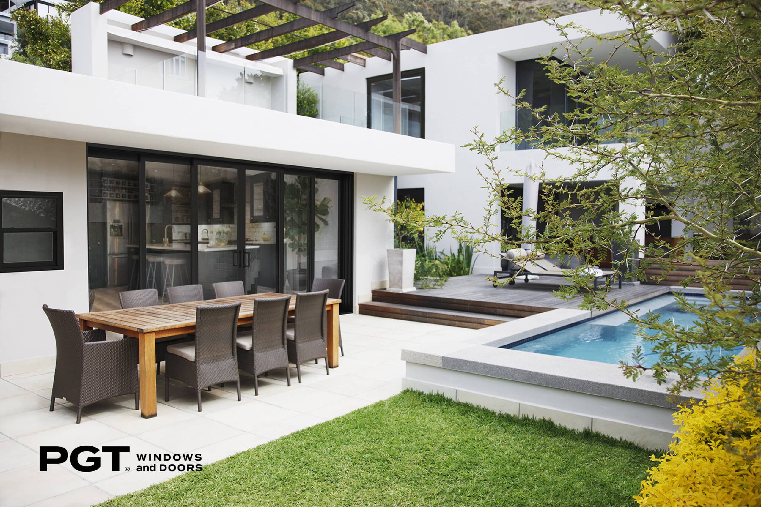 patio door on modern white house next to swimming pool