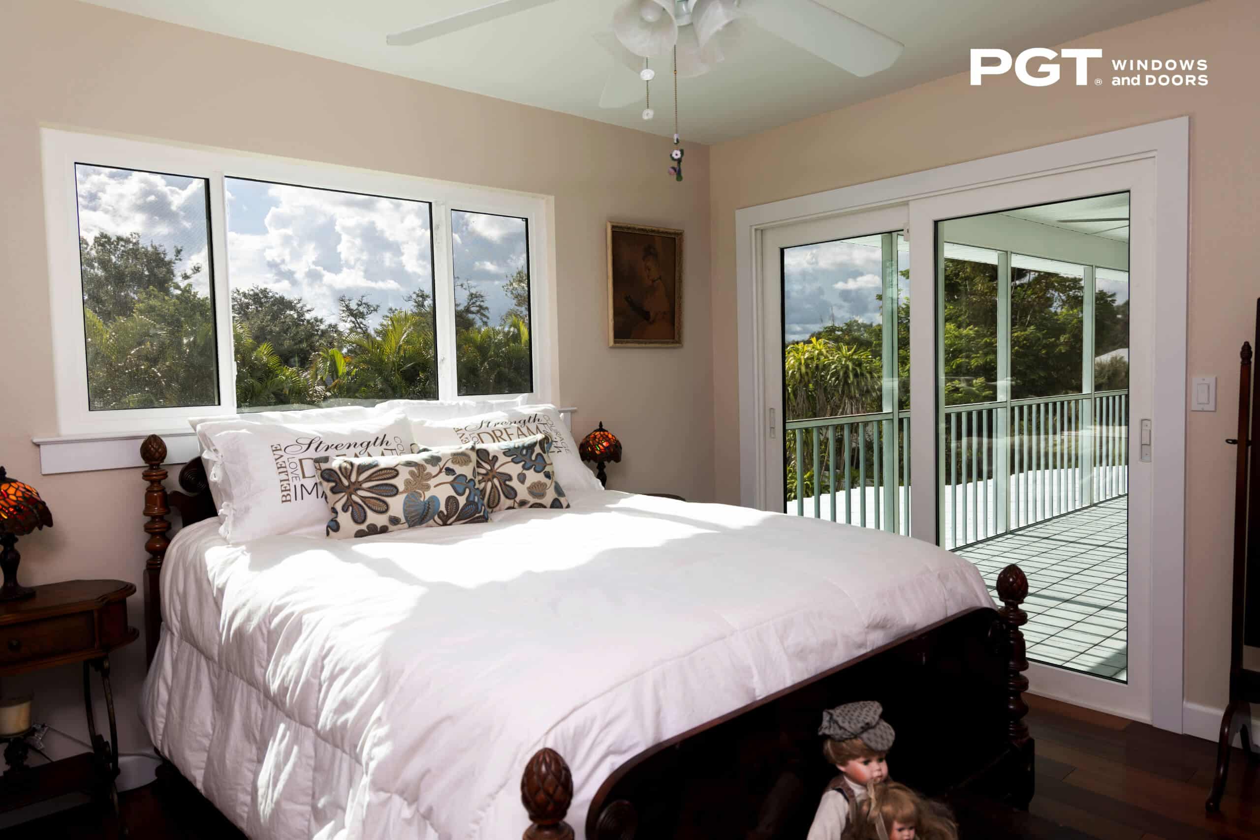 PGT impact windows and sliding glass doors bringing natural light into a bedroom in Vero Beach