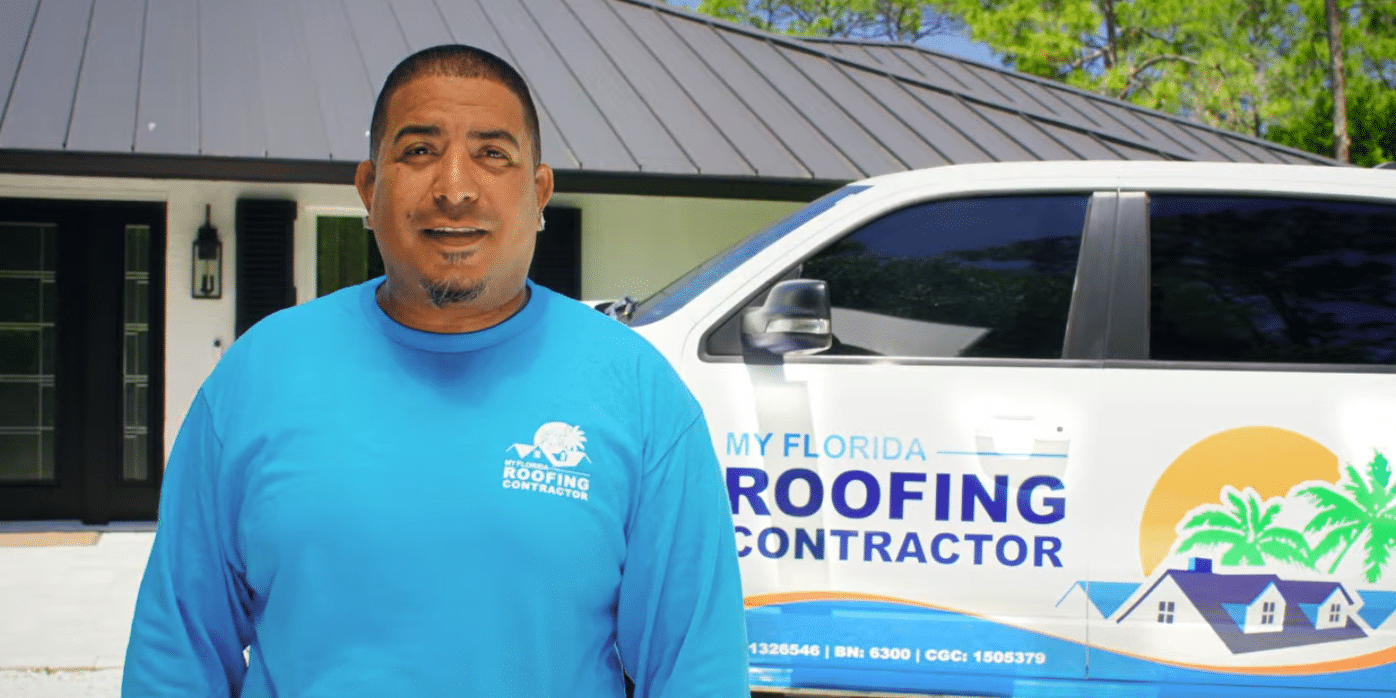 My Florida Roofing Contractor team member standing beside a branded company truck and a completed metal roof project