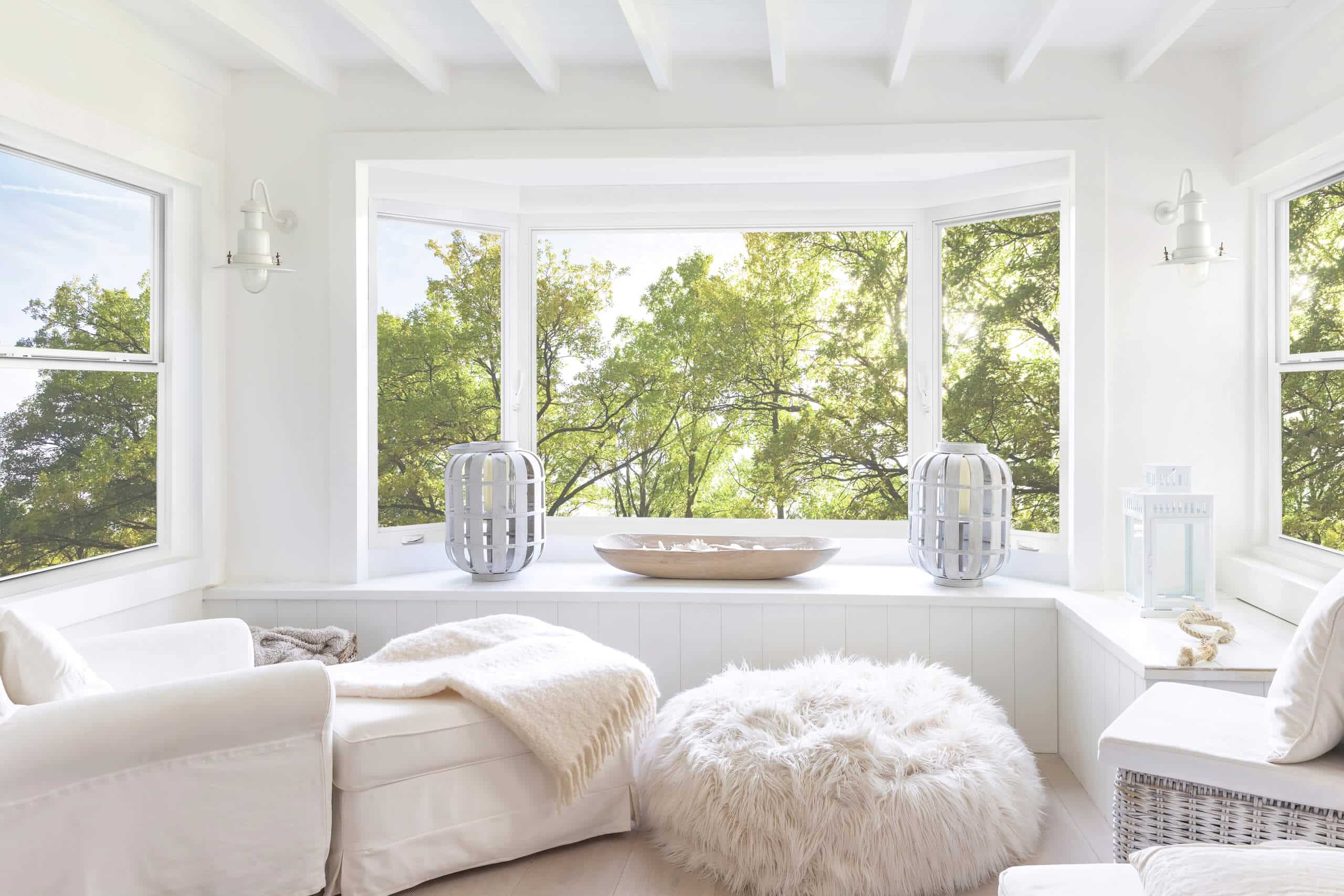 Energy-efficient bay windows bringing natural light into a bright sitting room