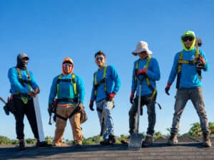 My Florida Roofing Contractor roofing crew in harnesses standing on top of a roof