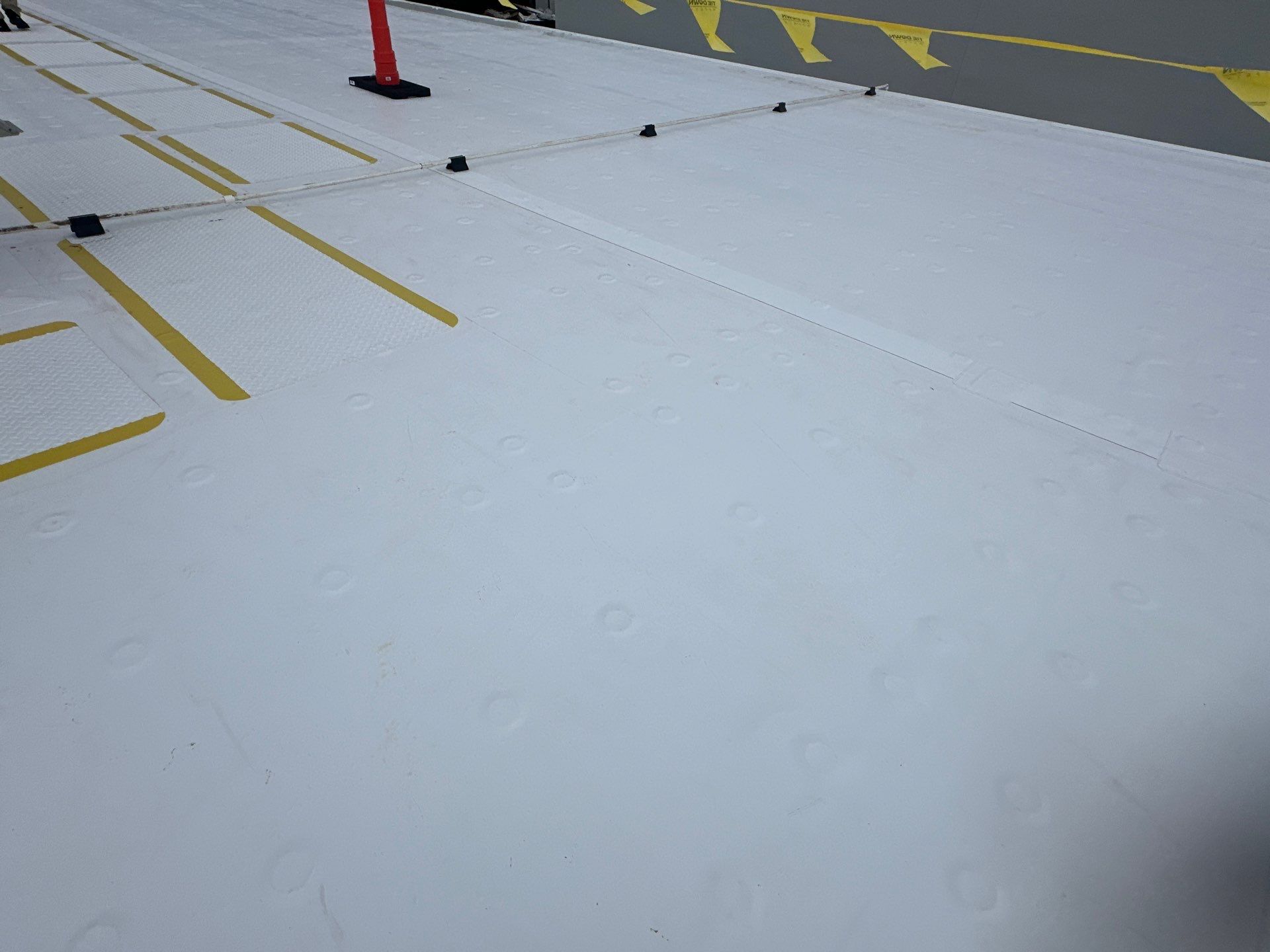 commercial seal coating application on commercial building roof