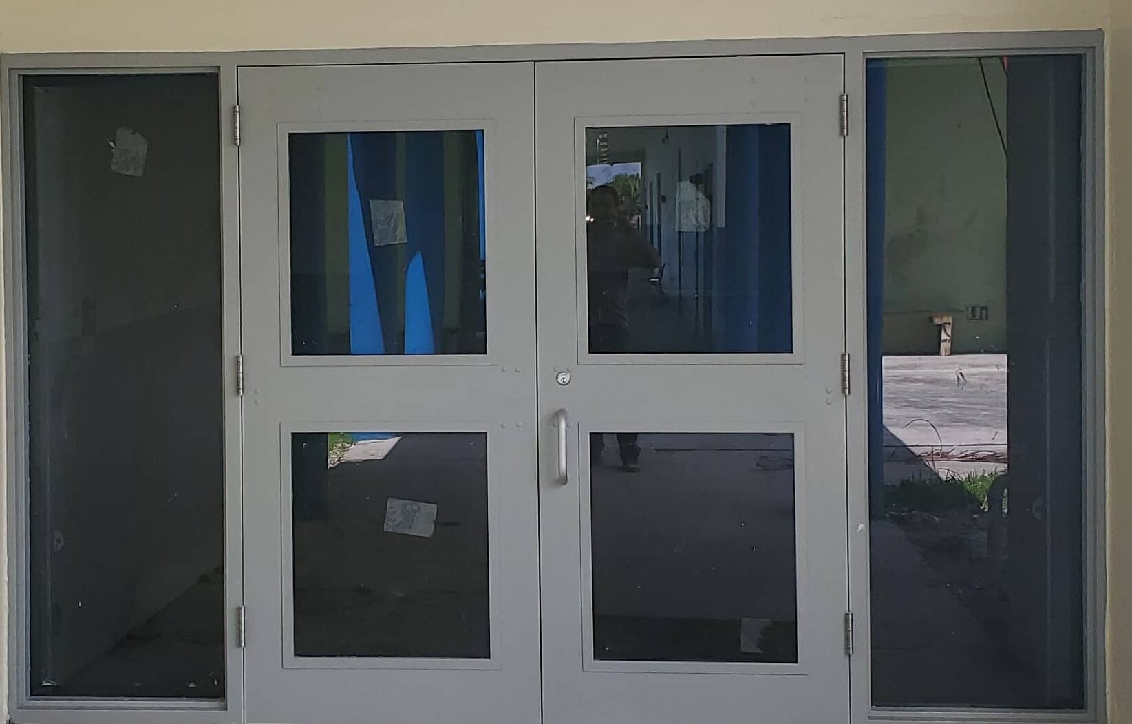 impact front entry doors in gray for a commercial building