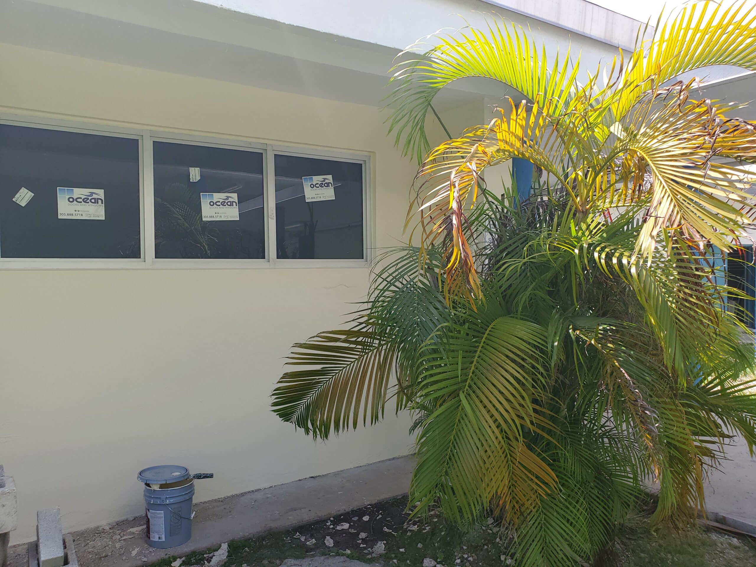 New impact windows installed on a Florida home undergoing exterior renovations